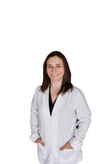 Dr. Erin Mauthe, BS, DC - professionally dressed female chiropractor